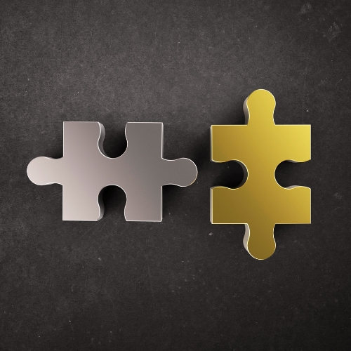 silver horizontal puzzle piece and gold vertical puzzle piece next to each other